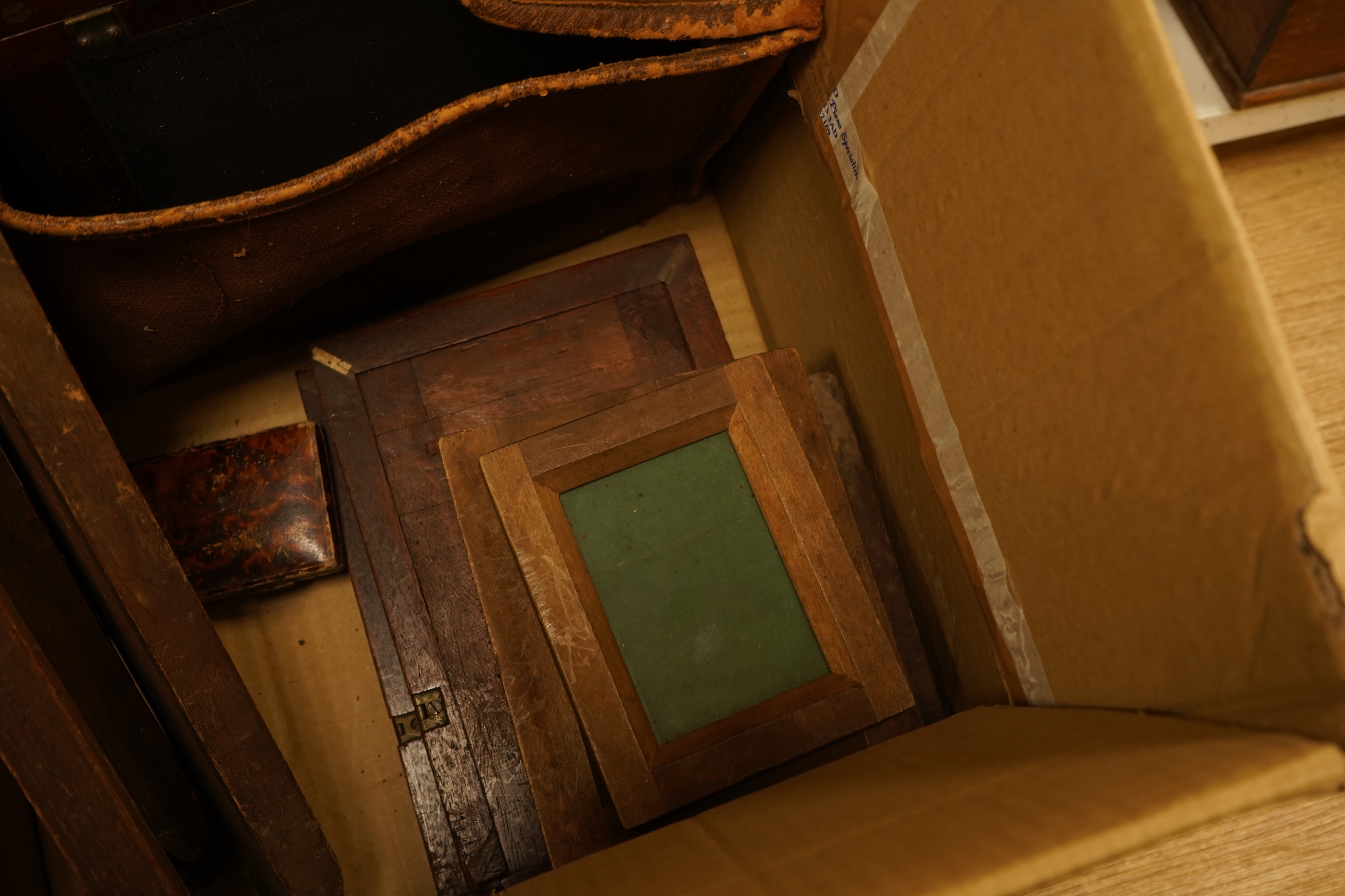 An early 20th century mahogany and brass half plate camera, filters and accessories